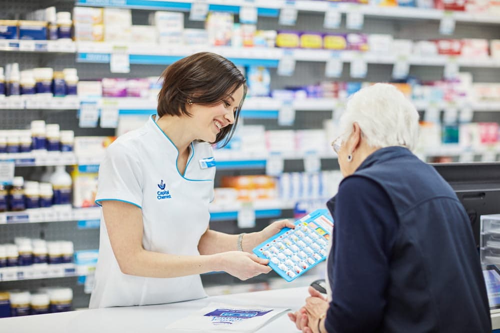 Pharmacist helping a customer
